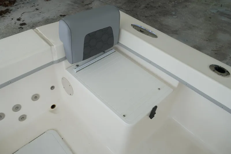 Slide: The Image of 2026 May-Craft 238 Center Console boat seat and storage compartment detail. - 21