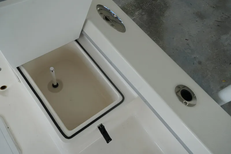 Slide: The Image of 2026 May-Craft 238 Center Console boat interior detail with storage compartment. - 22