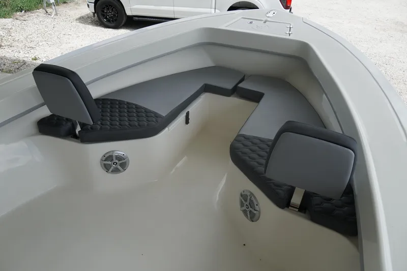 Slide: The Image of 2026 May-Craft 238 Center Console boat interior with cushioned seating and speakers. - 28
