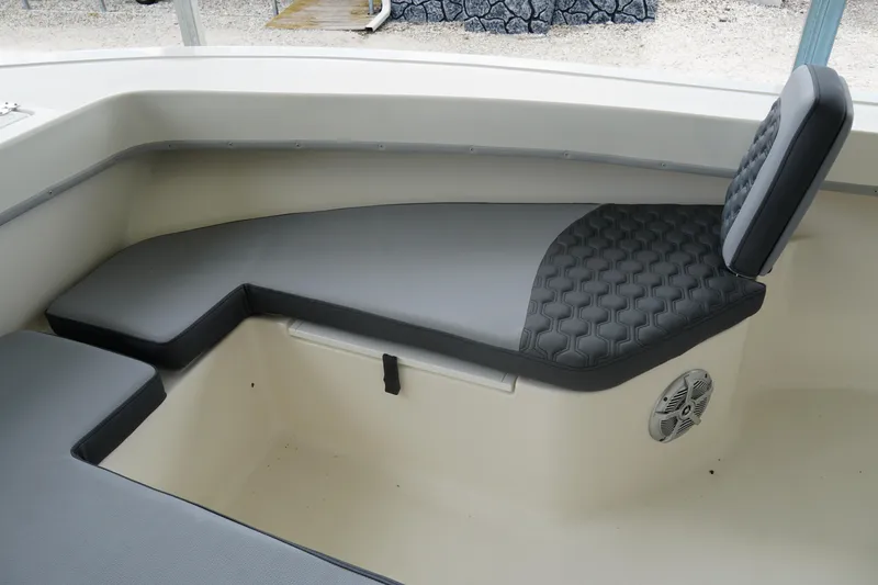Slide: The Image of 2026 May-Craft 238 Center Console boat interior with cushioned seating and speaker. - 32