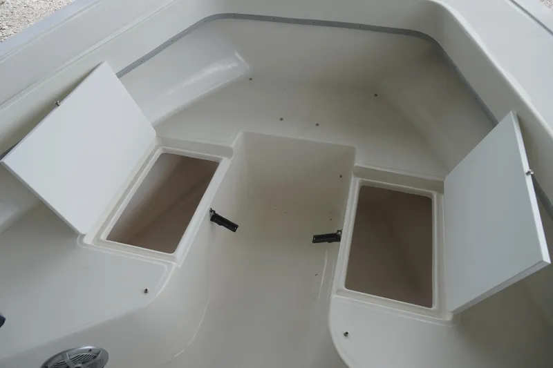 Slide: The Image of 2026 May-Craft 238 Center Console storage compartments, open and ready for use. - 35