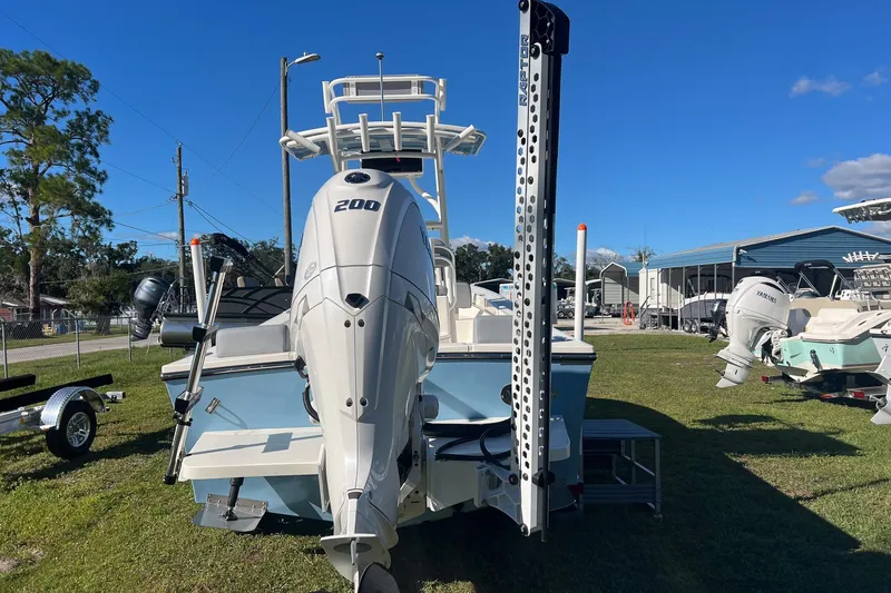 Slide: The Image of 2026 May-Craft 238 Center Console boat with powerful 200 engine, parked outdoors. - 4
