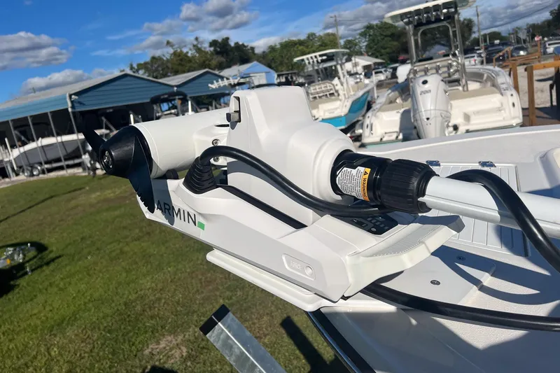 Slide: The Image of 2026 May-Craft 238 Center Console with Garmin equipment, displayed outdoors. - 54