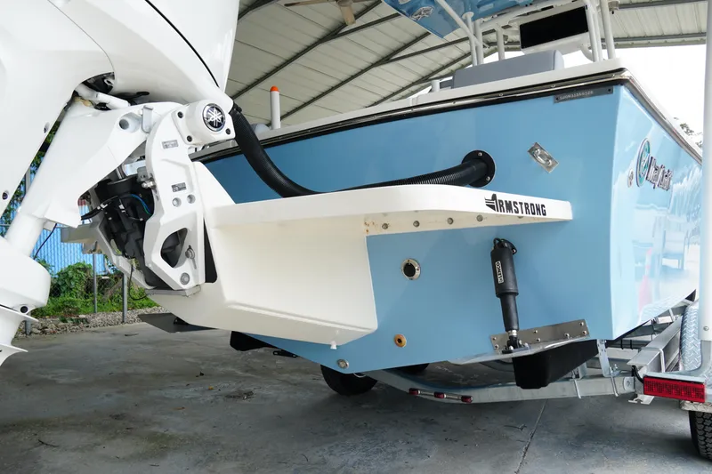 Slide: The Image of 2026 May-Craft 238 Center Console boat, blue hull, Armstrong bracket, on trailer. - 8