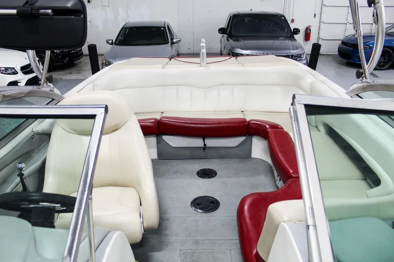 Slide: The Image of Interior of a 2002 MasterCraft X-10 boat with red and white seating. - 12