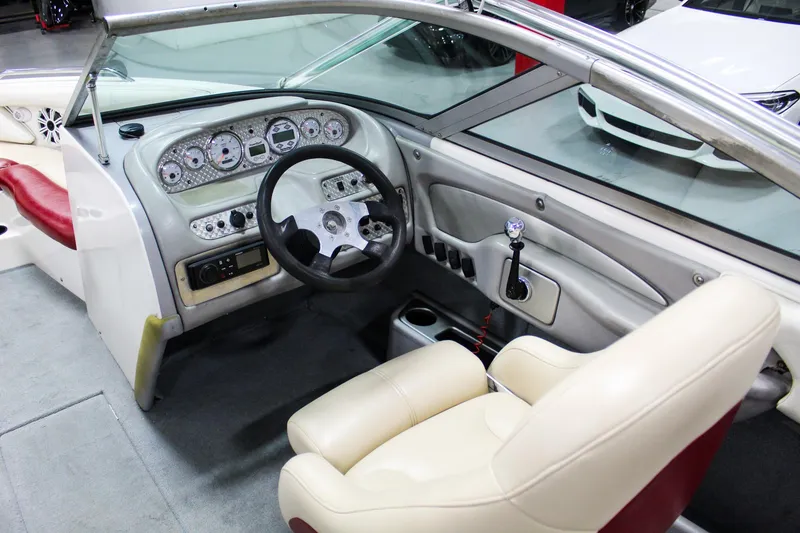 Slide: The Image of 2002 MasterCraft X-10 boat interior with steering wheel and dashboard controls. - 14