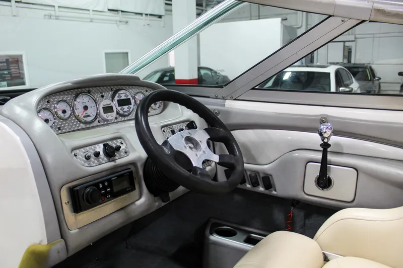 Slide: The Image of 2002 MasterCraft X-10 boat interior dashboard with steering wheel and control panel. - 17