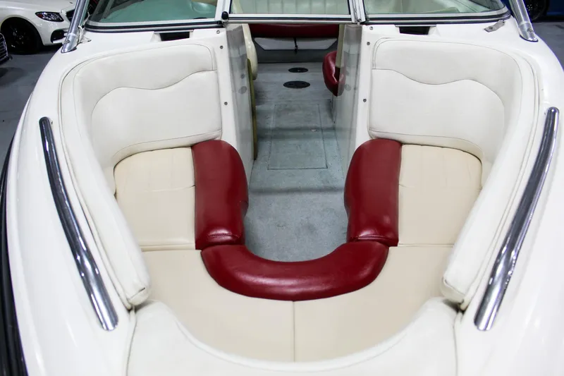 Slide: The Image of 2002 MasterCraft X-10 boat interior with red and white seating. - 19