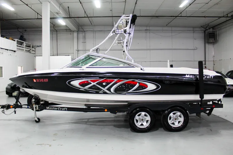Slide: The Image of 2002 MasterCraft X-10 boat on trailer in indoor showroom. - 2