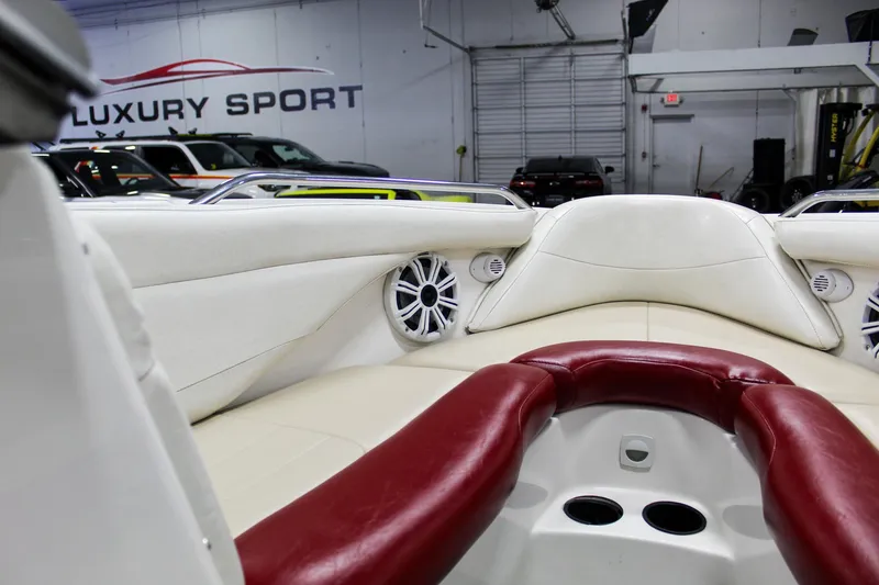 Slide: The Image of 2002 MasterCraft X-10 boat interior with red and white seating in a showroom. - 20