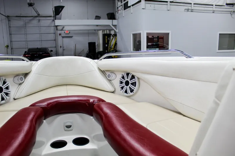 Slide: The Image of 2002 MasterCraft X-10 boat interior with red and white seating, speakers, and modern design. - 21