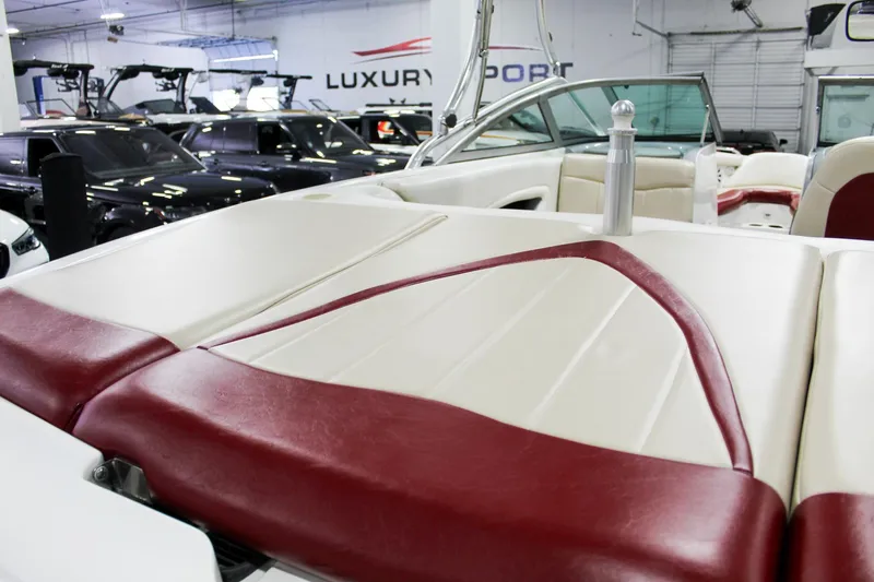 Slide: The Image of 2002 MasterCraft X-10 boat interior with red and white upholstery in showroom. - 29