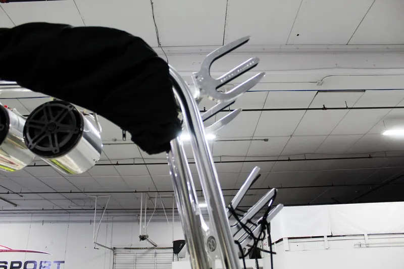 Slide: The Image of 2002 MasterCraft X-10 boat tower with speakers and wakeboard racks in a garage. - 31