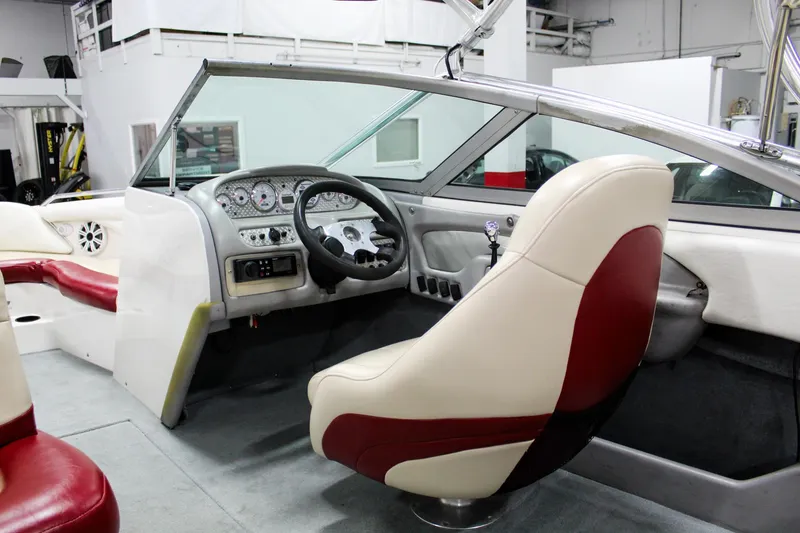 Slide: The Image of Interior of a 2002 MasterCraft X-10 boat with steering wheel and dashboard. - 35