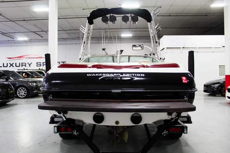 Slide: The Image of 2002 MasterCraft X-10 Wakeboard Edition boat in showroom, rear view. - 5