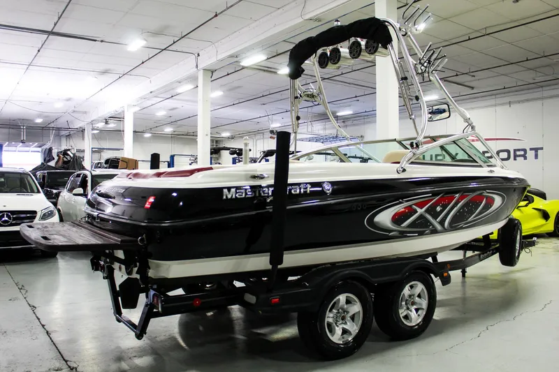 Slide: The Image of 2002 MasterCraft X-10 boat on trailer in indoor showroom. - 6