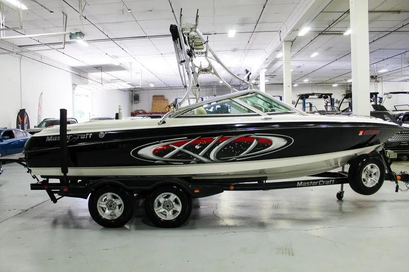 Slide: The Image of 2002 MasterCraft X-10 boat on trailer in indoor showroom. - 7
