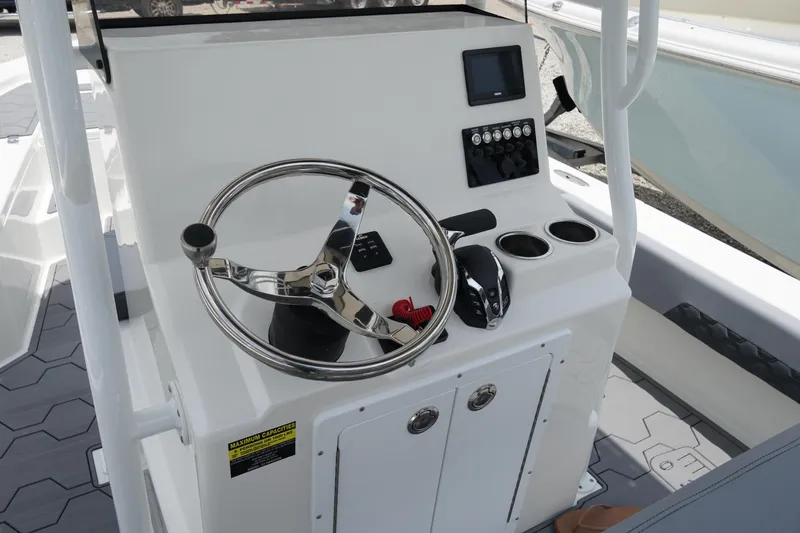 Slide: The Image of 2026 May-Craft 220 Bay boat console with steering wheel and control panel. - 12