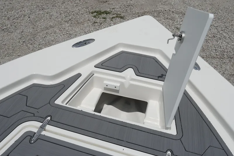 Slide: The Image of 2026 May-Craft 220 Bay boat deck with open storage compartment. - 18