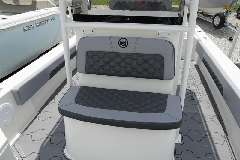 Slide: The Image of 2026 May-Craft 220 Bay boat interior with hexagonal-patterned seating and sleek design. - 19
