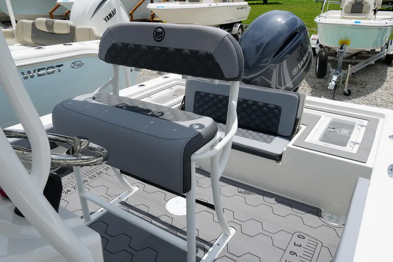 Slide: The Image of 2026 May-Craft 220 Bay boat interior with seating and Yamaha engine. - 21