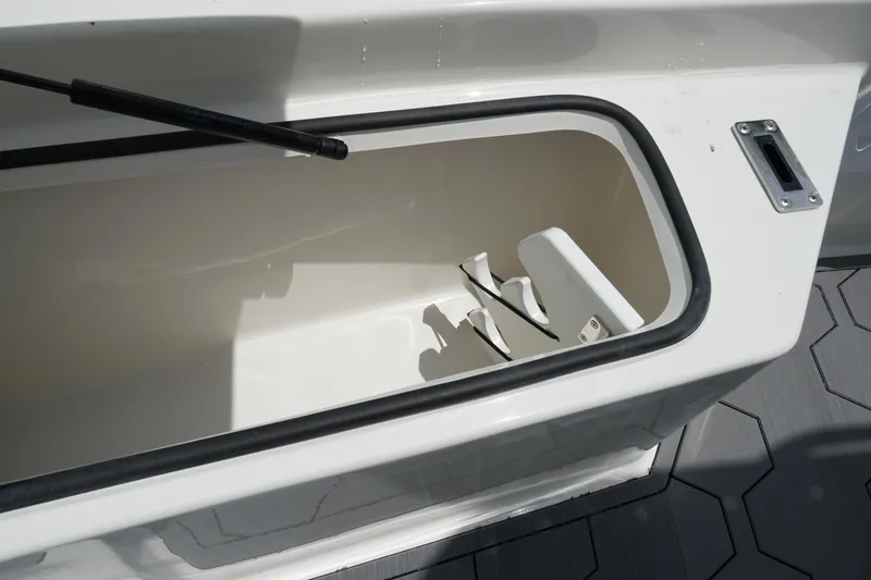 Slide: The Image of Open storage compartment on a 2026 May-Craft 220 Bay boat. - 27