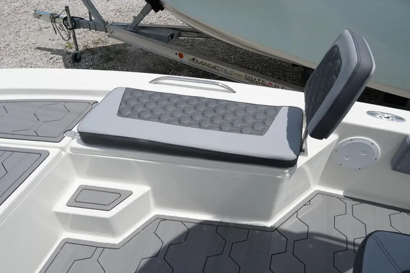 Slide: The Image of 2026 May-Craft 220 Bay boat seating with gray cushioned upholstery and textured flooring. - 30