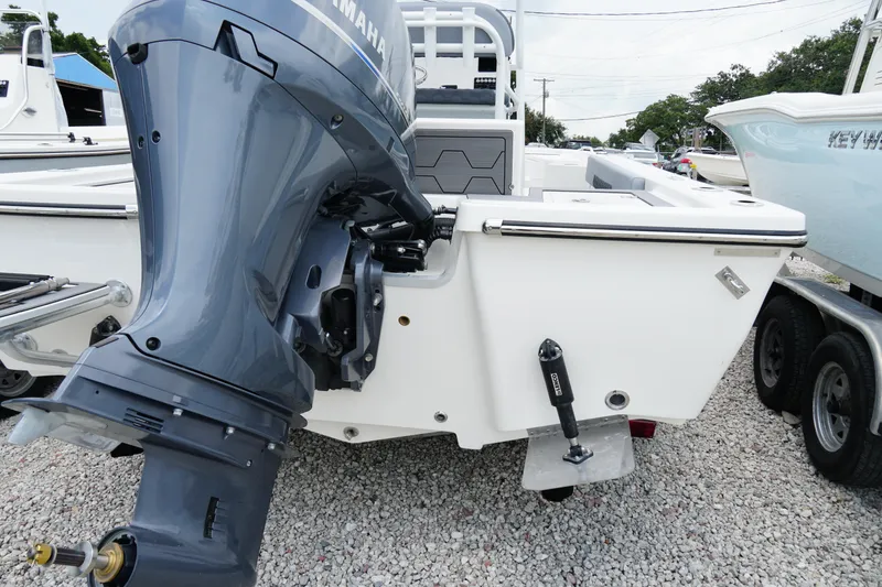 Slide: The Image of 2026 May-Craft 220 Bay boat with Yamaha outboard motor on gravel lot. - 39