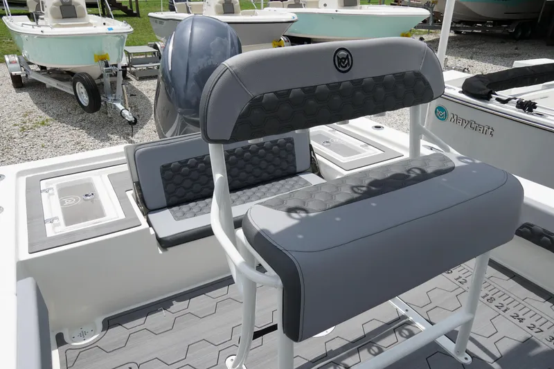 Slide: The Image of 2026 May-Craft 220 Bay boat interior with gray seating and modern design. - 4