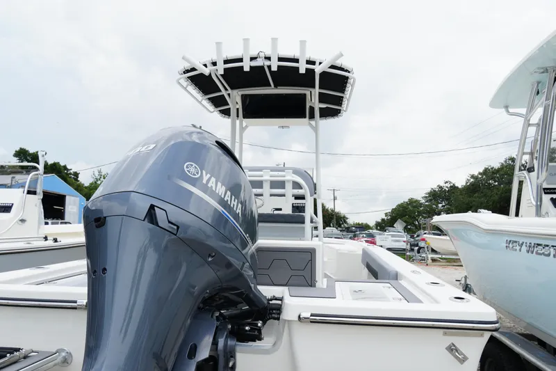 Slide: The Image of 2026 May-Craft 220 Bay boat with Yamaha engine, docked in a marina. - 40