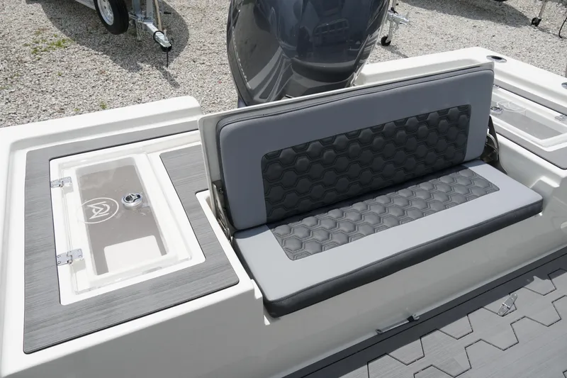 Slide: The Image of 2026 May-Craft 220 Bay boat seating and storage detail, featuring modern design and functionality. - 7