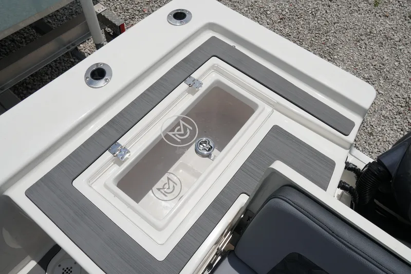 Slide: The Image of 2026 May-Craft 220 Bay boat deck with storage compartment and seating. - 8