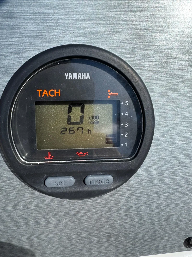 Slide: The Image of Yamaha tachometer displaying 267 hours on a 2011 Clearwater 21 WAC boat. - 4
