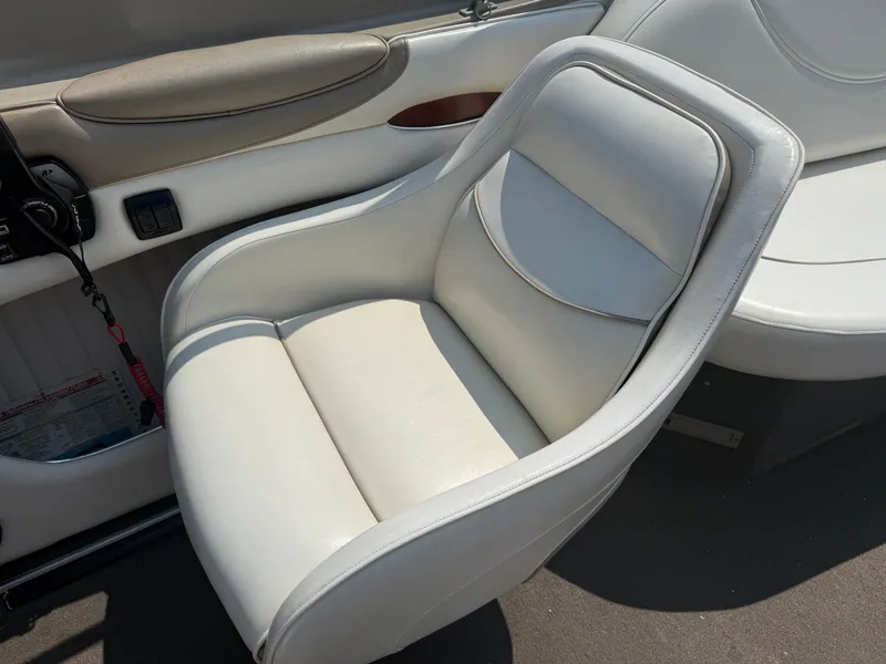 Slide: The Image of White leather seat in 1999 Bayliner 2350 Capri SS boat interior. - 11