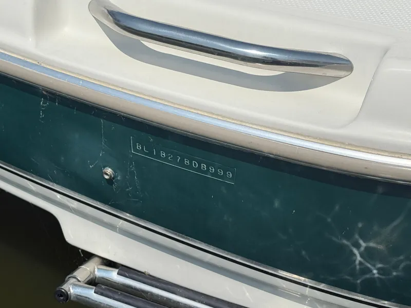 Slide: The Image of 1999 Bayliner 2350 Capri SS boat with visible hull identification number. - 17