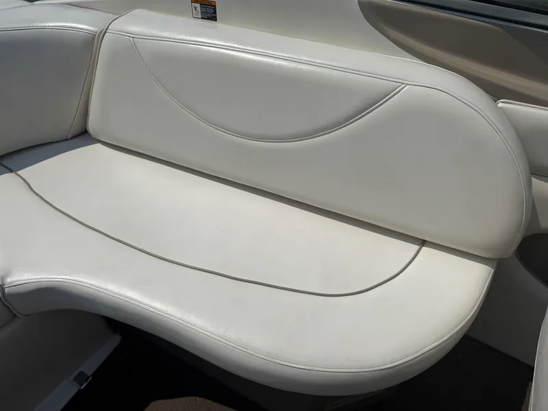 Slide: The Image of 1999 Bayliner 2350 Capri SS boat interior with white leather seating. - 4