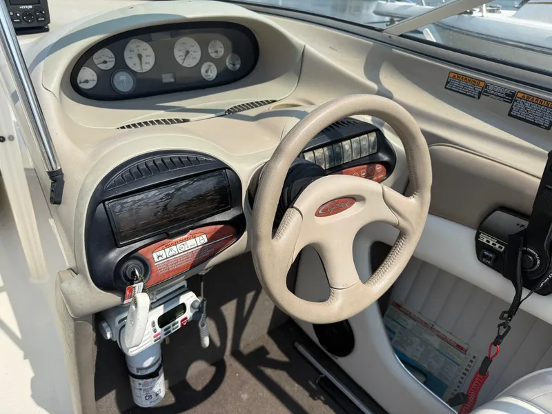 Slide: The Image of 1999 Bayliner 2350 Capri SS dashboard with steering wheel and instrument panel. - 9