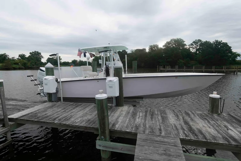 Slide: The Image of 2023 Rambo 27 Center Console boat docked on a wooden pier. - 3