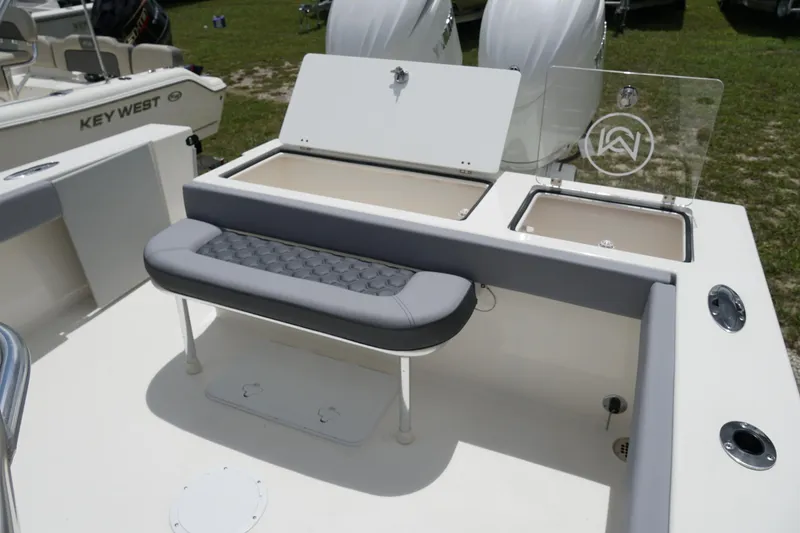 Slide: The Image of 2026 May-Craft 245 Offshore CC boat interior with seating and storage compartments. - 11
