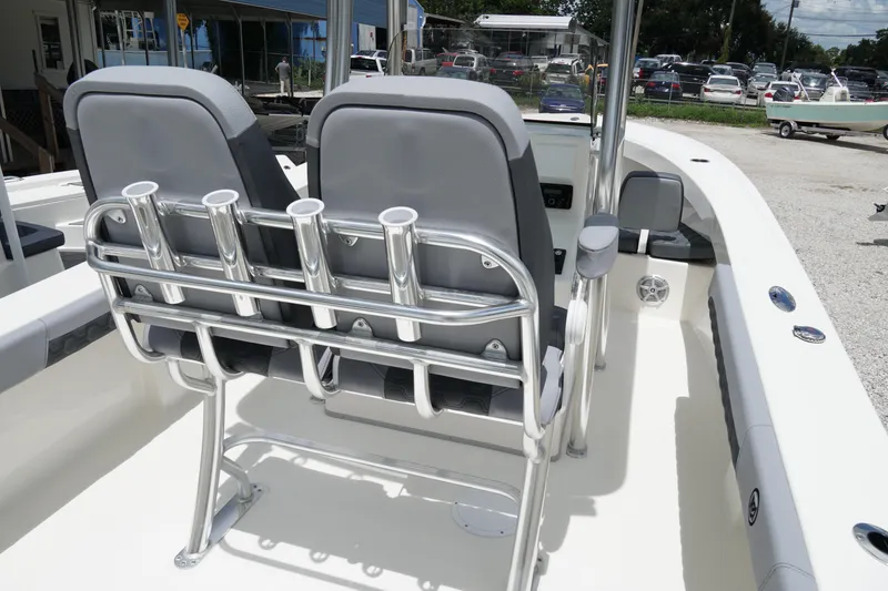 Slide: The Image of 2026 May-Craft 245 Offshore CC boat interior with dual seats and rod holders. - 12