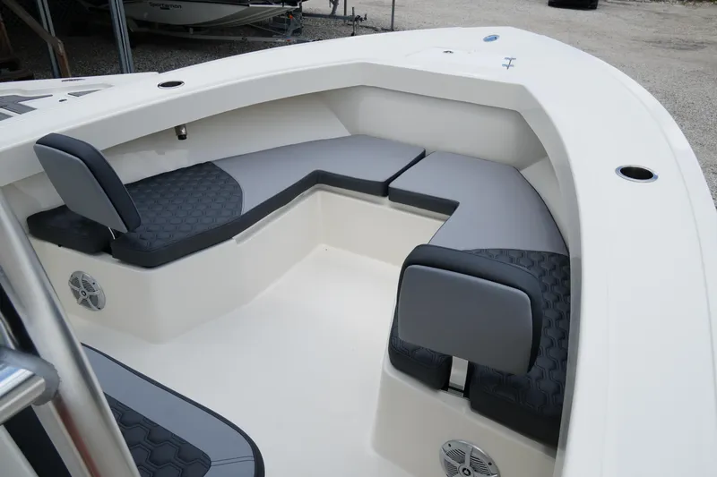 Slide: The Image of 2026 May-Craft 245 Offshore CC boat interior with cushioned seating and modern design. - 14