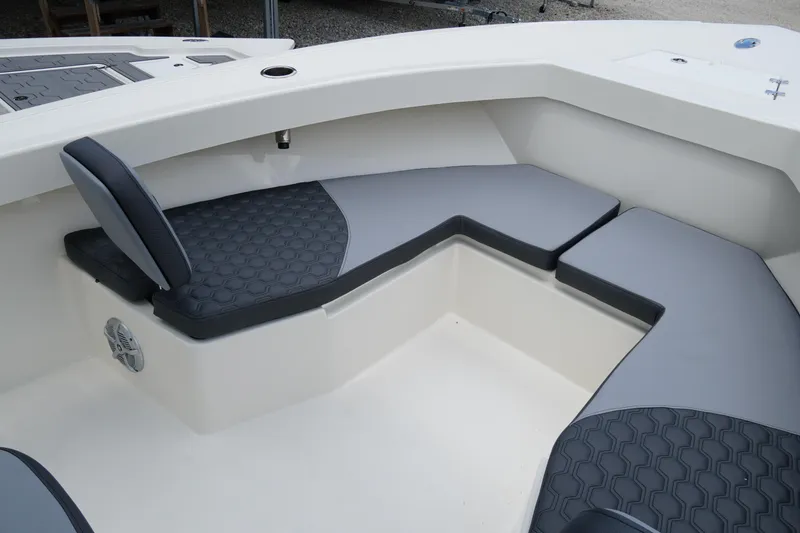 Slide: The Image of 2026 May-Craft 245 Offshore CC boat interior with cushioned seating and modern design. - 15