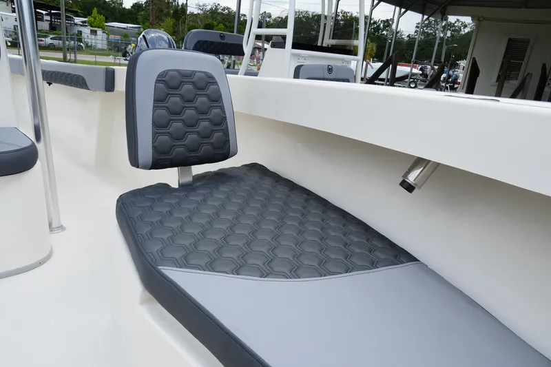 Slide: The Image of 2026 May-Craft 245 Offshore CC boat interior with hexagonal-patterned seating. - 16