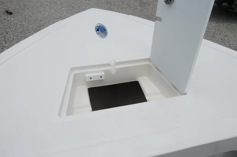 Slide: The Image of 2026 May-Craft 245 Offshore CC boat storage compartment with open hatch. - 23