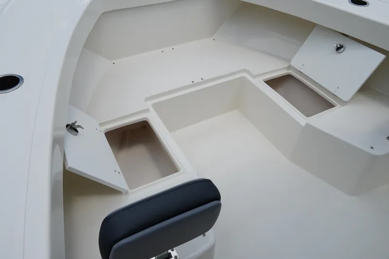Slide: The Image of 2026 May-Craft 245 Offshore CC boat interior with open storage compartments. - 24