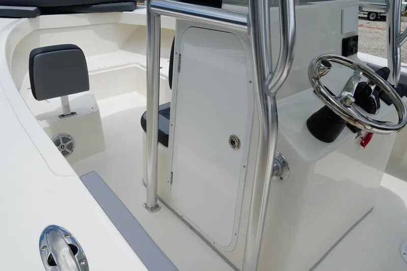 Slide: The Image of 2026 May-Craft 245 Offshore CC boat interior with steering wheel and seating. - 27