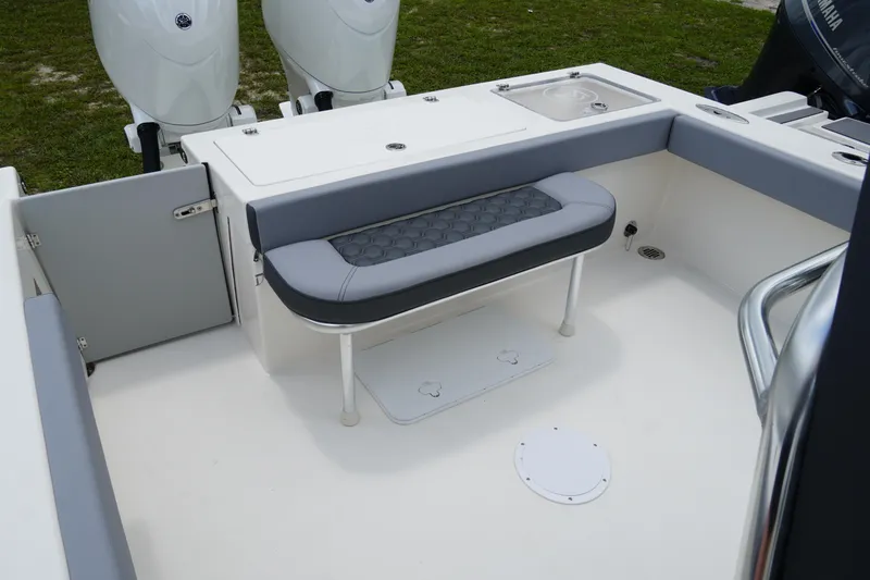 Slide: The Image of 2026 May-Craft 245 Offshore CC boat interior with seating and dual outboard motors. - 3