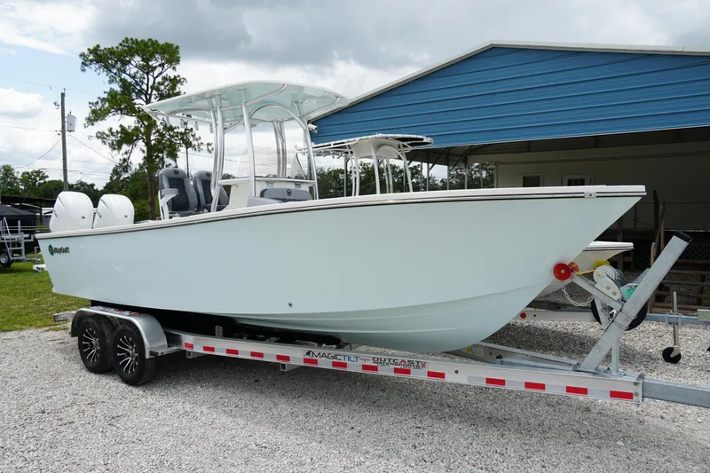 Slide: The Image of 2026 May-Craft 245 Offshore CC boat on trailer, parked outdoors. - 38