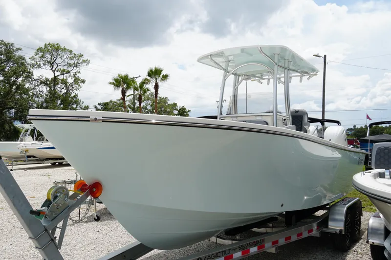 Slide: The Image of 2026 May-Craft 245 Offshore CC boat on trailer, under cloudy sky. - 39