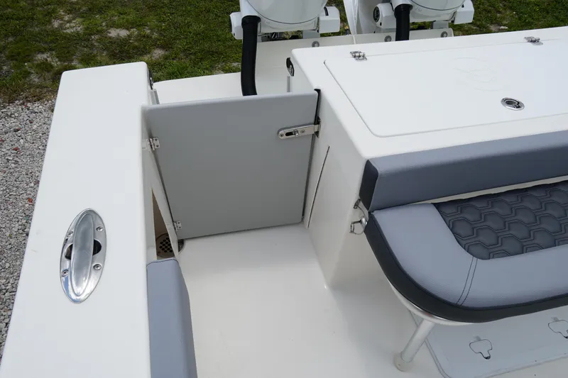 Slide: The Image of 2026 May-Craft 245 Offshore CC boat interior with seating and storage compartment. - 5